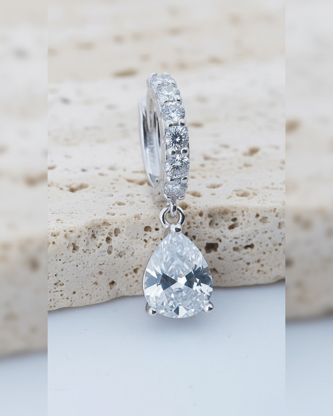 CZ tear drop shape huggie hoop earring.