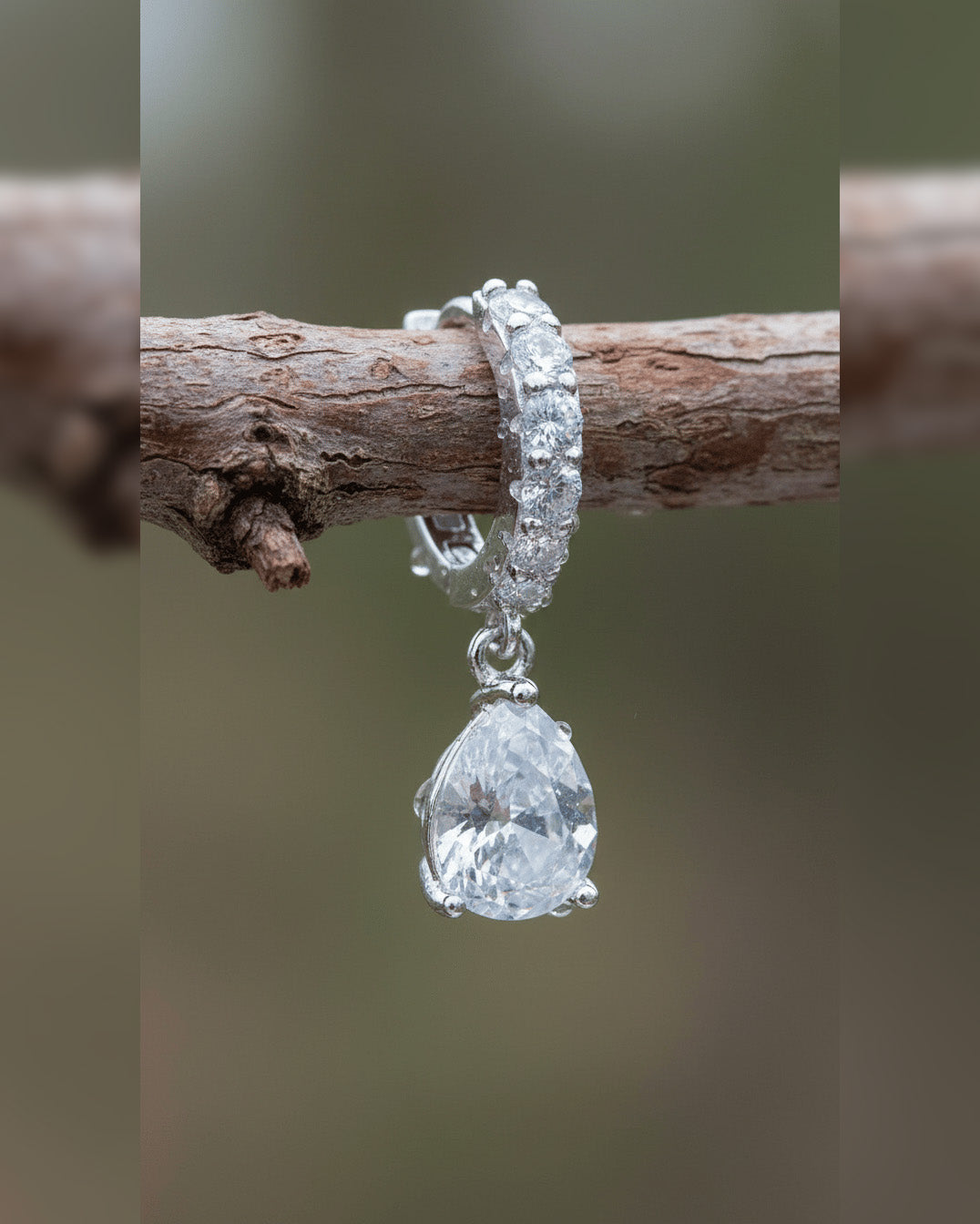 CZ tear drop shape huggie hoop earring.