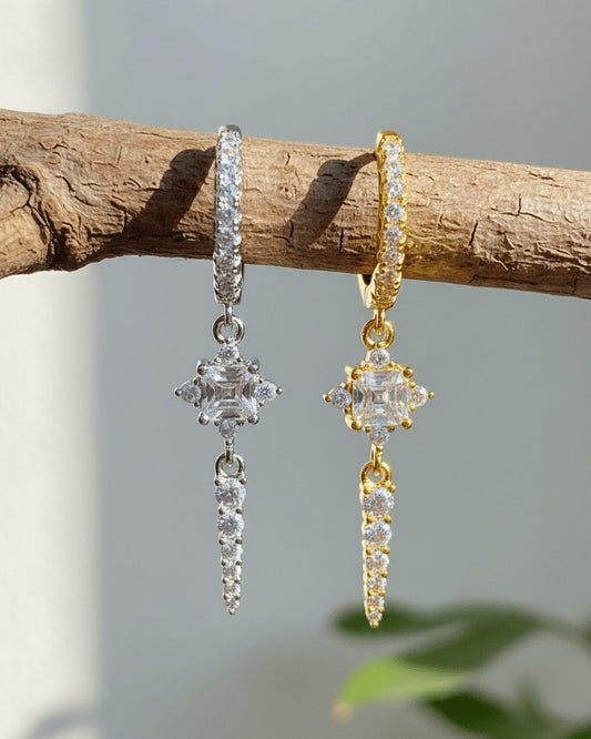 CZ luxury hoop earring with dangling rectangular stone and graduated round stones.