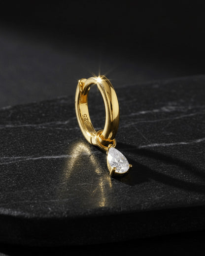 plain golden hoop with removable dangling drop shape stone.