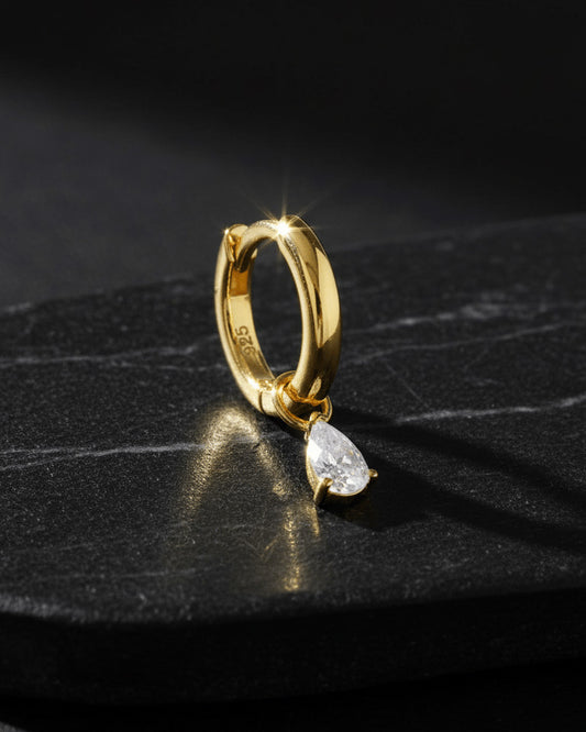 plain golden hoop with removable dangling drop shape stone.