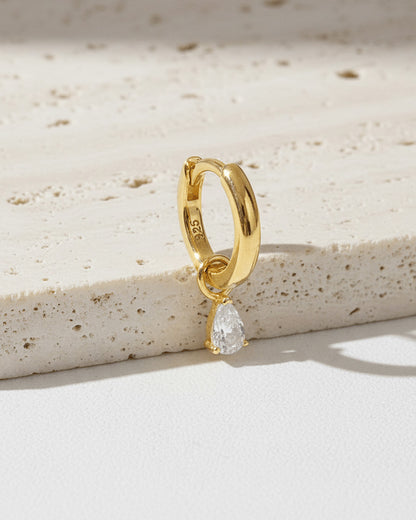 plain golden hoop with removable dangling drop shape stone.