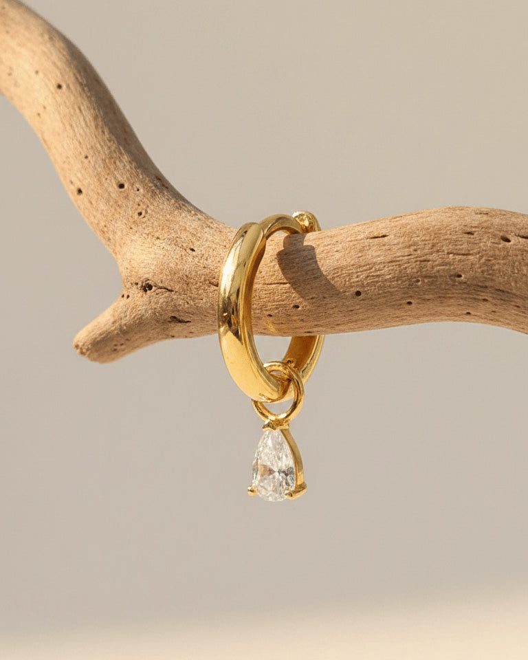plain golden hoop with removable dangling drop shape stone.