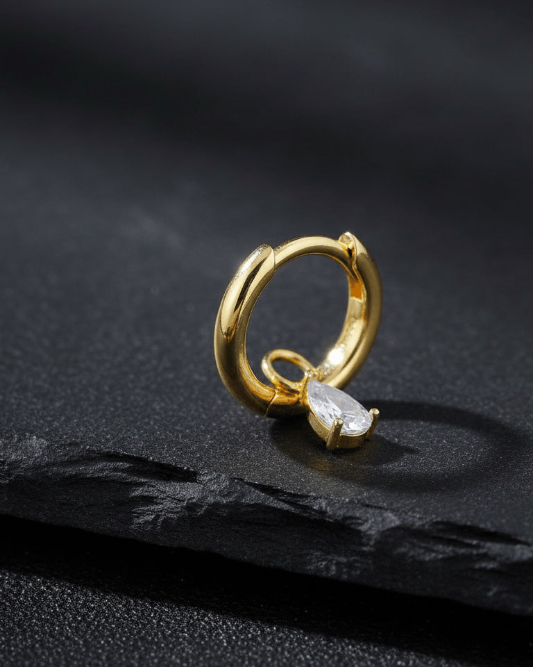 plain golden hoop with removable dangling drop shape stone.