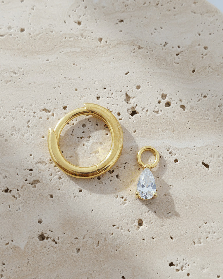 plain golden hoop with removable dangling drop shape stone.