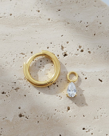 plain golden hoop with removable dangling drop shape stone.