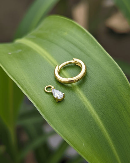 plain golden hoop with removable dangling drop shape stone.