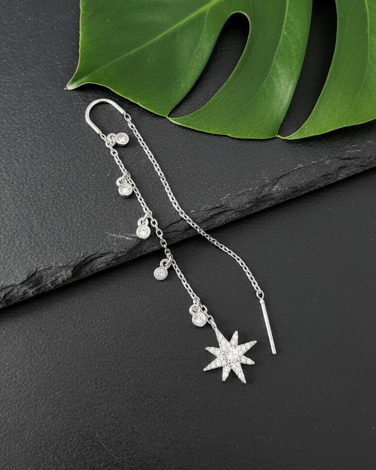 threader star earring with dangling CZ in bezel setting.