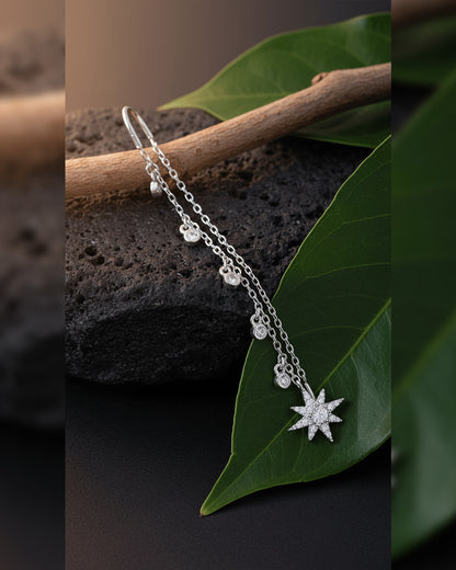threader star earring with dangling CZ in bezel setting.