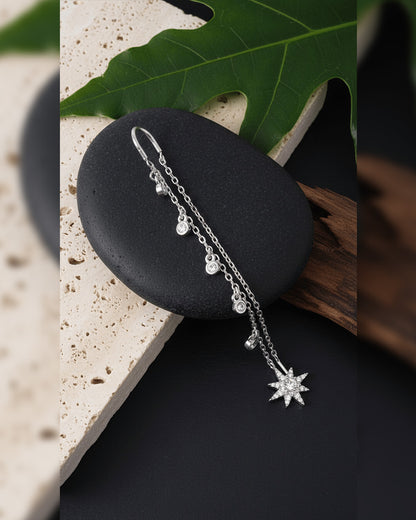 threader star earring with dangling CZ in bezel setting.
