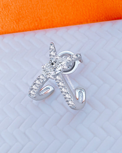 X shape huggie hoop with marquise center stone.