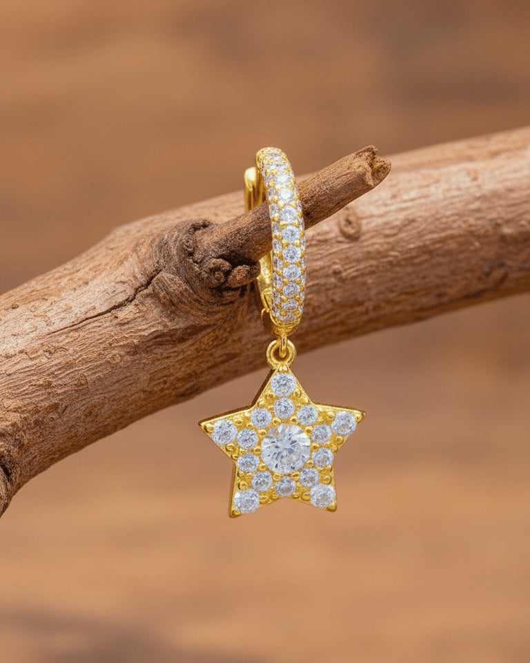 Dangling star hoops earrings.