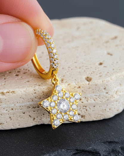 Dangling star hoops earrings.