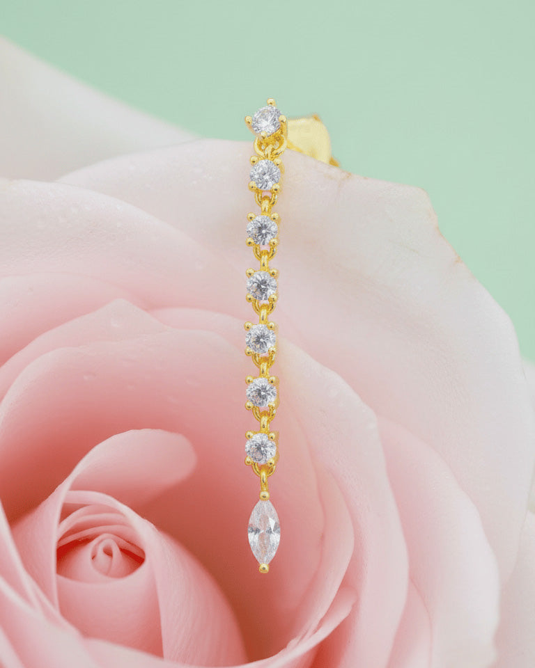 line of delicate links with round CZ ends with a marquise shape stud earring.