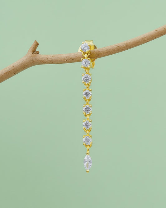 line of delicate links with round CZ ends with a marquise shape stud earring.