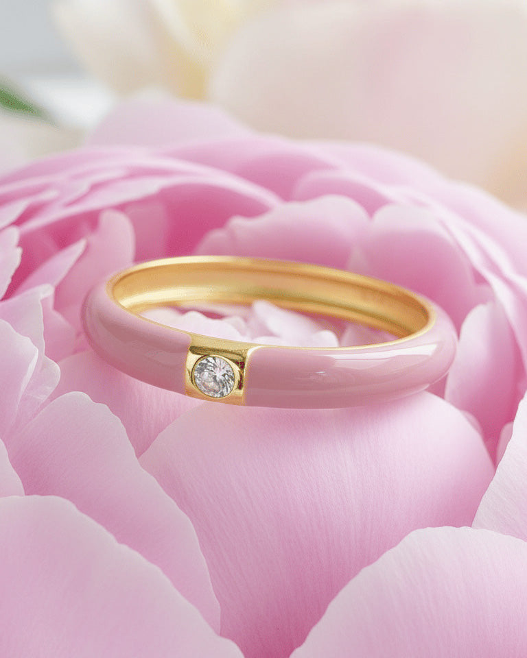 Enamel colors eternity rings with one round CZ stone.