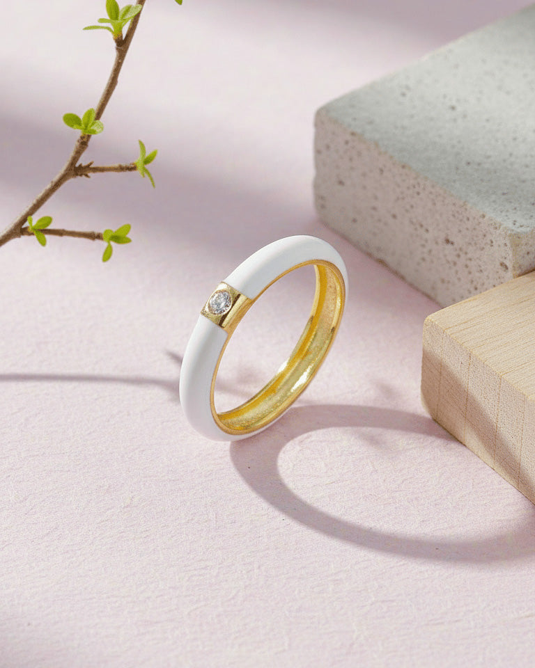 Enamel colors eternity rings with one round CZ stone.