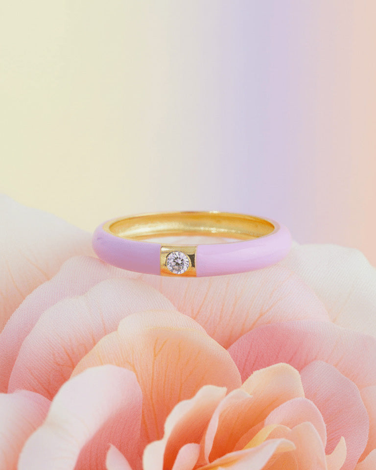 Enamel colors eternity rings with one round CZ stone.