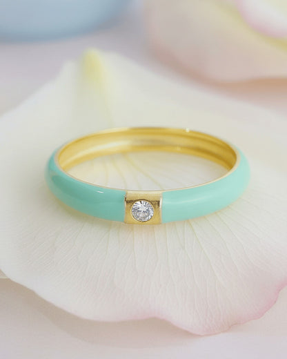 Enamel colors eternity rings with one round CZ stone.