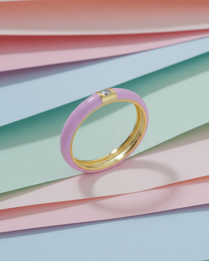 Enamel colors eternity rings with one round CZ stone.