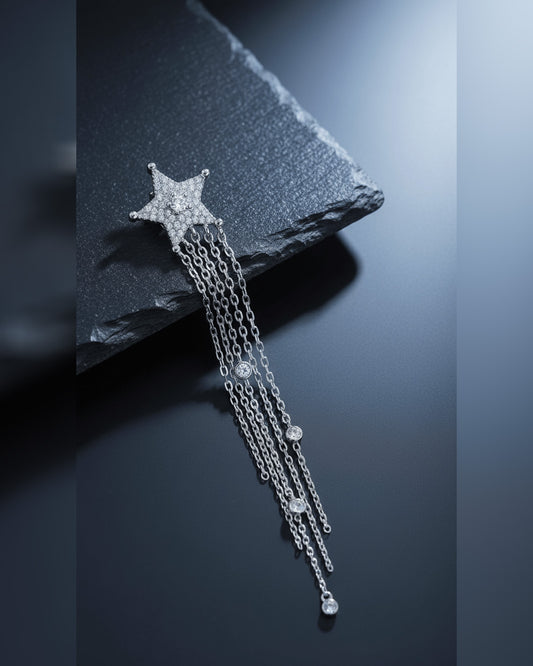 Star stud earring with long dangling chains.