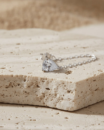 Pear shape back to front dangling chain earring.