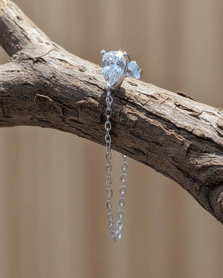 Pear shape back to front dangling chain earring.